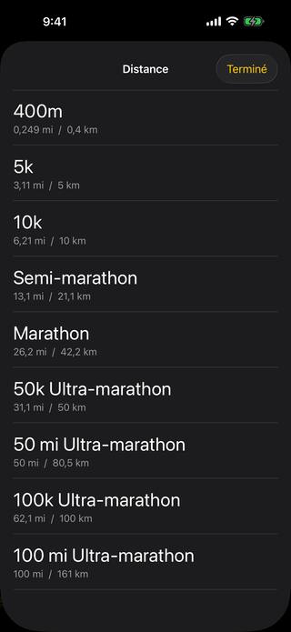 La liste des distances de course : 400m, 5k, 10k, semi-marathon, marathon, et les ultra-marathons de 50k, 50 miles, 100k et 100 miles, chacun affiché à la fois en miles et en kilomètres.